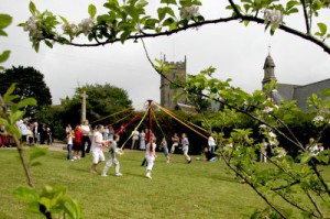 The children of Madron dance around the maypole in the Memorial Garden
